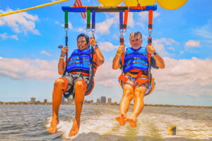 Making Memories 2 David and Gio Skelton, harnessed to a parachute, being lifted into the air by a boat, parasailing 500 feet above Biscayne Bay, Miami