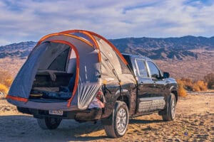 Maximizing Your One-Day Adventure in Joshua Tree National Park 2 Nissan Frontier with Rightline truck tent set up at Joshua Tree National Park BLM dispersed camping area.