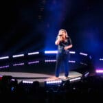 Kelly Clarkson barefoot singing on stage at Viejas Arena, San Diego State University, Piece By Piece Tour 2015