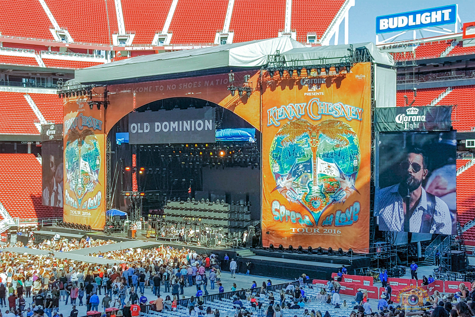 Wide view of the large concert stage for Kenny Chesney's "Spread the Love Tour" inside a packed Levi's Stadium, with the band Old Dominion performing.