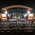 Wide view of the outdoor stage and empty seats at North Island Credit Union Amphitheatre, Chula Vista, California, before the OneRepublic concert in 2022.