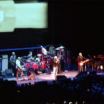 Live performance photo of The Who, including Roger Daltrey and Pete Townshend, at their final North American farewell concert in Palm Desert, CA, October 1, 2025.